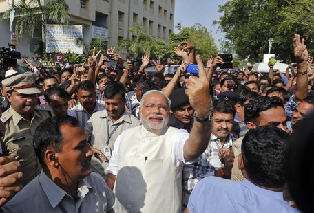 Hindu nationalist Narendra Modi (C), the prime ministerial candidate for India's main opposition Bharatiya Janata Party (BJP), shows his ink Hindu nationalist Narendra Modi (C), the prime ministerial candidate for India's main opposition Bharatiya Janata Party (BJP), shows his ink