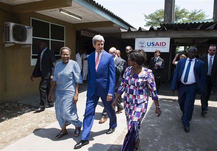 U.S. Secretary of State John Kerry (C) walks alongside Hospital Director Dolores Nembunzu (R) and Sister Mary Joseph (L) at the Fistula Clin U.S. Secretary of State John Kerry (C) walks alongside Hospital Director Dolores Nembunzu (R) and Sister Mary Joseph (L) at the Fistula Clin
