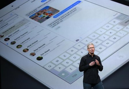 Apple Inc CEO Tim Cook speaks on stage about the new iPad during an Apple event in San Francisco, California October 22, 2013 file photo. RE Apple Inc CEO Tim Cook speaks on stage about the new iPad during an Apple event in San Francisco, California October 22, 2013 file photo. RE