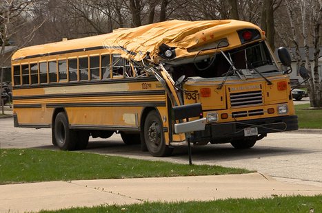 A school bus is seen on Aspen Ln. in Green Bay May 5, 2014, after hitting a tree. (Photo from: FOX 11). A school bus is seen on Aspen Ln. in Green Bay May 5, 2014, after hitting a tree. (Photo from: FOX 11).