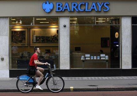 A man rides a bicycle past a Barclays bank in London August 5, 2010. REUTERS/Suzanne Plunkett A man rides a bicycle past a Barclays bank in London August 5, 2010. REUTERS/Suzanne Plunkett