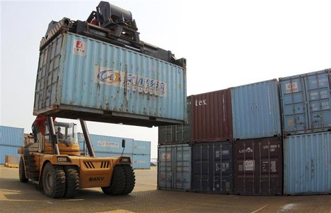 A forklift transfers a shipping container for export at a port in Lianyungang, Jiangsu province May 5, 2014. REUTERS/China Daily A forklift transfers a shipping container for export at a port in Lianyungang, Jiangsu province May 5, 2014. REUTERS/China Daily