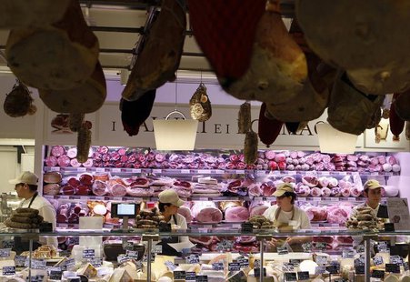 Employees work at the butchery work bench during the opening day of upmarket Italian food hall chain Eataly's flagship store in downtown Mil Employees work at the butchery work bench during the opening day of upmarket Italian food hall chain Eataly's flagship store in downtown Mil