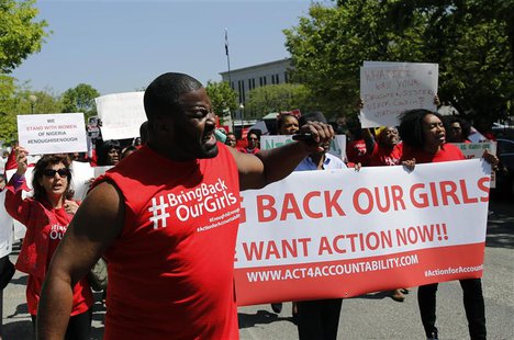 Protesters march in support of the girls kidnapped by members of Boko Haram in front of the Nigerian Embassy in Washington May 6, 2014. REUT Protesters march in support of the girls kidnapped by members of Boko Haram in front of the Nigerian Embassy in Washington May 6, 2014. REUT