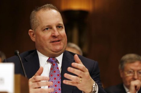 Chief Financial Officer and executive vice president of Target John Mulligan answers a question while testifying at the Senate Judiciary Com Chief Financial Officer and executive vice president of Target John Mulligan answers a question while testifying at the Senate Judiciary Com