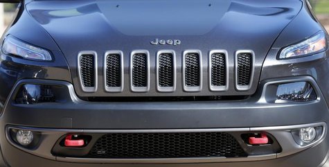 The front grill of a 2014 Chrysler Jeep Cherokee Trailhawk is seen on display outside Chrysler World Headquarters during the FCA Investors D The front grill of a 2014 Chrysler Jeep Cherokee Trailhawk is seen on display outside Chrysler World Headquarters during the FCA Investors D