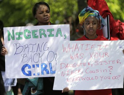 Protesters hold signs during a march in support of the girls kidnapped by members of Boko Haram in front of the Nigerian Embassy in Washington May 6, 2014. CREDIT: REUTERS/GARY CAMERON Protesters hold signs during a march in support of the girls kidnapped by members of Boko Haram in front of the Nigerian Embassy in Washington May 6, 2014. CREDIT: REUTERS/GARY CAMERON