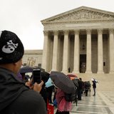 A man takes a picture with his mobile device outside of the U.S. Supreme Court in Washington April 29, 2014. REUTERS/Gary Cameron A man takes a picture with his mobile device outside of the U.S. Supreme Court in Washington April 29, 2014. REUTERS/Gary Cameron