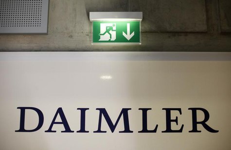 A emergency exit sign is pictured above a logo of German car manufacturer Daimler AG, before the annual news conference in Stuttgart Februar A emergency exit sign is pictured above a logo of German car manufacturer Daimler AG, before the annual news conference in Stuttgart Februar