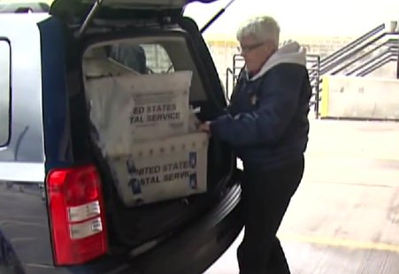 File photo of helping with the Stamp Out Hunger Food Drive in Brown County. (Photo from: FOX 11/YouTube). File photo of helping with the Stamp Out Hunger Food Drive in Brown County. (Photo from: FOX 11/YouTube).