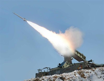A rocket is fired during a drill of drone planes assaulting targets and a firing drill of self-propelled flak rocket destroying "enemy" crui A rocket is fired during a drill of drone planes assaulting targets and a firing drill of self-propelled flak rocket destroying "enemy" crui