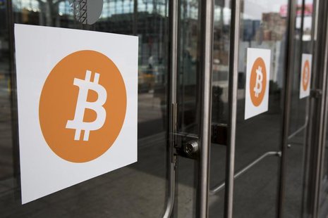 Bitcoin themed stickers stand attached to glass doors during the Inside Bitcoins: The Future of Virtual Currency Conference in New York Apri Bitcoin themed stickers stand attached to glass doors during the Inside Bitcoins: The Future of Virtual Currency Conference in New York Apri