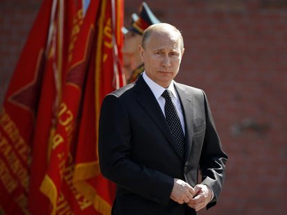 Russian President Vladimir Putin takes part in a wreath-laying ceremony by the Kremlin wall on the eve of the Victory Day celebrations in ce Russian President Vladimir Putin takes part in a wreath-laying ceremony by the Kremlin wall on the eve of the Victory Day celebrations in ce