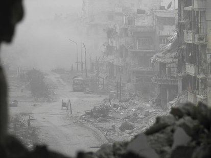 Smoke rises from buildings after what activists said was shelling from forces loyal to Syria's President Bashar al-Assad in the besieged are Smoke rises from buildings after what activists said was shelling from forces loyal to Syria's President Bashar al-Assad in the besieged are