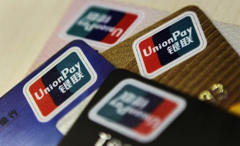 Logos of China UnionPay are seen on bank cards in this photo illustration taken in Beijing December 5, 2013. REUTERS/Barry Huang Logos of China UnionPay are seen on bank cards in this photo illustration taken in Beijing December 5, 2013. REUTERS/Barry Huang