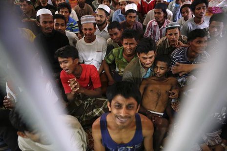 Rohingya people from Myanmar, who were rescued from human traffickers, react in a communal cell at the Songkhla Immigration Detention Centre Rohingya people from Myanmar, who were rescued from human traffickers, react in a communal cell at the Songkhla Immigration Detention Centre