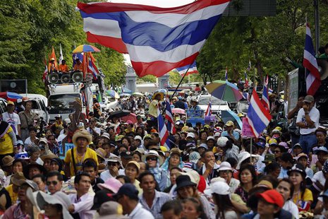Anti-government protesters wait for their leader Suthep Thaugsuban to come out from the parliament building to address them in Bangkok May 9 Anti-government protesters wait for their leader Suthep Thaugsuban to come out from the parliament building to address them in Bangkok May 9