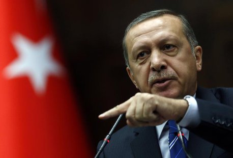 Turkey's Prime Minister Tayyip Erdogan addresses members of parliament from his ruling AK Party (AKP) during a meeting at the Turkish parlia Turkey's Prime Minister Tayyip Erdogan addresses members of parliament from his ruling AK Party (AKP) during a meeting at the Turkish parlia