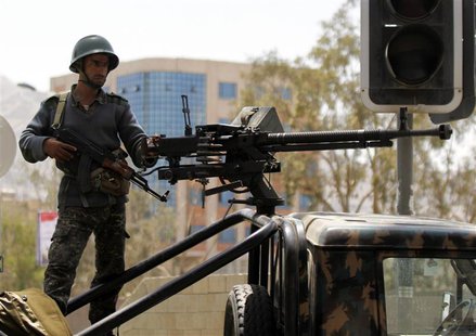 A soldier stands guard on a military vehicle at a checkpoint on a road to the city of Sanaa, May 11, 2014. REUTERS/ Mohamed al-Sayaghi A soldier stands guard on a military vehicle at a checkpoint on a road to the city of Sanaa, May 11, 2014. REUTERS/ Mohamed al-Sayaghi