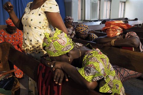 Churchgoers pray for the release of secondary school girls abducted from in the remote village of Chibok, at an Evangelical Church of West A Churchgoers pray for the release of secondary school girls abducted from in the remote village of Chibok, at an Evangelical Church of West A