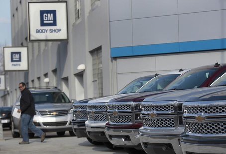 A man walks past a row of General Motors vehicles at a Chevrolet dealership on Woodward Avenue in Detroit, Michigan April 1, 2014. REUTERS/R A man walks past a row of General Motors vehicles at a Chevrolet dealership on Woodward Avenue in Detroit, Michigan April 1, 2014. REUTERS/R