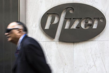 A man walks past Pfizer's world headquarters in New York April 28, 2014. REUTERS/Andrew Kelly A man walks past Pfizer's world headquarters in New York April 28, 2014. REUTERS/Andrew Kelly