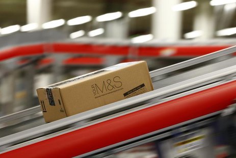 A parcel travels along a belt at the new Marks & Spencer e-commerce distribution centre in Castle Donington, central England May 8, 2013. RE A parcel travels along a belt at the new Marks & Spencer e-commerce distribution centre in Castle Donington, central England May 8, 2013. RE