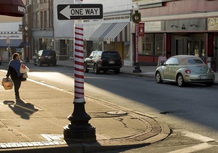 A woman walks along Main Street in Pawtucket, Rhode Island December 2, 2008. REUTERS/Brian Snyder A woman walks along Main Street in Pawtucket, Rhode Island December 2, 2008. REUTERS/Brian Snyder