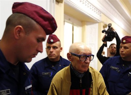 Former Communist Party leader Bela Biszku escorted by police during his trial in Budapest on May 13, 2014. REUTERS/Laszlo Balogh Former Communist Party leader Bela Biszku escorted by police during his trial in Budapest on May 13, 2014. REUTERS/Laszlo Balogh