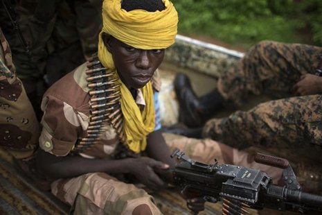Former Seleka soldiers drive to a village, where residents say was attacked and a mosque burnt the night before by anti-Balaka militiamen, a Former Seleka soldiers drive to a village, where residents say was attacked and a mosque burnt the night before by anti-Balaka militiamen, a