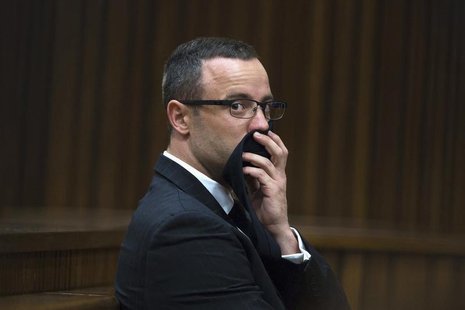 Oscar Pistorius looks on during his trial at the North Gauteng High Court in Pretoria, May 13, 2014. REUTERS/Daniel Born/Pool Oscar Pistorius looks on during his trial at the North Gauteng High Court in Pretoria, May 13, 2014. REUTERS/Daniel Born/Pool