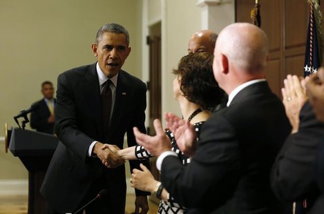 U.S. President Barack Obama (L) shakes hands with Director of Domestic Policy Cecilia Munoz after speaking to law enforcement leaders from a U.S. President Barack Obama (L) shakes hands with Director of Domestic Policy Cecilia Munoz after speaking to law enforcement leaders from a