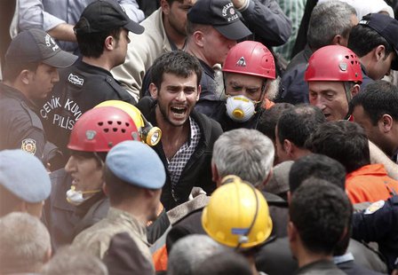 A relative of a miner who was killed or injured in a mine explosion reacts as rescuers work in Soma, a district in Turkey's western province A relative of a miner who was killed or injured in a mine explosion reacts as rescuers work in Soma, a district in Turkey's western province