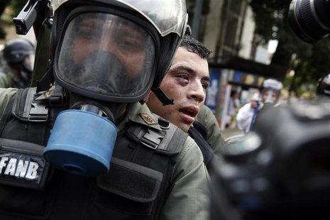 Venezuela's national guards detain an anti-government protester during a protest against President Nicolas Maduro's government in Caracas Ma Venezuela's national guards detain an anti-government protester during a protest against President Nicolas Maduro's government in Caracas Ma