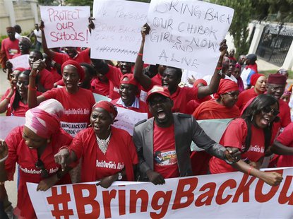 Nigerians take part in a protest demanding for the release of secondary school girls abducted from the remote village of Chibok, in Asokoro, Nigerians take part in a protest demanding for the release of secondary school girls abducted from the remote village of Chibok, in Asokoro,