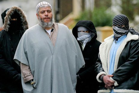 A file photograph dated February 7, 2003 shows Muslim cleric Sheikh Abu Hamza (2L) outside the North London Mosque at Finsbury Park surround A file photograph dated February 7, 2003 shows Muslim cleric Sheikh Abu Hamza (2L) outside the North London Mosque at Finsbury Park surround