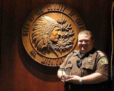 Ottawa Co. Sheriff's Deputy Ben Terpstra with his 2014 First Quarter Outstanding Customer Service Award (photo courtesy Ottawa Co. Government) Ottawa Co. Sheriff's Deputy Ben Terpstra with his 2014 First Quarter Outstanding Customer Service Award (photo courtesy Ottawa Co. Government)