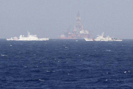 Chinese oil rig Haiyang Shi You 981 (C) is seen surrounded by ships of China Coast Guard in the South China Sea, about 210 km (130 miles) of Chinese oil rig Haiyang Shi You 981 (C) is seen surrounded by ships of China Coast Guard in the South China Sea, about 210 km (130 miles) of