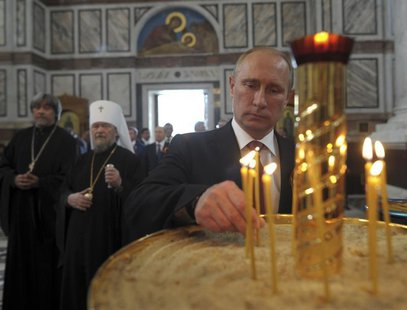 Russian President Vladimir Putin attends an Orthodox service in St. Vladimir's Cathedral in Sevastopol May 9, 2014. REUTERS/Alexei Druzhinin Russian President Vladimir Putin attends an Orthodox service in St. Vladimir's Cathedral in Sevastopol May 9, 2014. REUTERS/Alexei Druzhinin