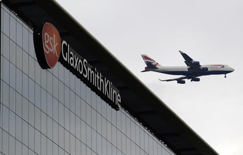 A British Airways airplane flies past a signage for pharmaceutical giant GlaxoSmithKline (GSK) in London April 22, 2014. REUTERS/Luke MacGre A British Airways airplane flies past a signage for pharmaceutical giant GlaxoSmithKline (GSK) in London April 22, 2014. REUTERS/Luke MacGre