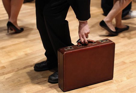 A man grabs his briefcase as he waits in line to speak with employers at the UJA-Federation Connect to Care job fair in New York, March 21, A man grabs his briefcase as he waits in line to speak with employers at the UJA-Federation Connect to Care job fair in New York, March 21,
