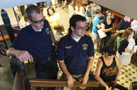 Steven Gibson and Mark Hightower (R) wait to receive their marriage license at the Pulaski County Courthouse in Little Rock, Arkansas May 12 Steven Gibson and Mark Hightower (R) wait to receive their marriage license at the Pulaski County Courthouse in Little Rock, Arkansas May 12