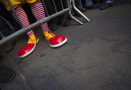 A protester Ben dressed up as Ronald McDonald, only known as Ben, takes part in a protest outside a McDonalds restaurant to demand higher wages for fast food workers in the Manhattan borough of New York March 18, 2014.
CREDIT: REUTERS/CARLO ALLEGRI A protester Ben dressed up as Ronald McDonald, only known as Ben, takes part in a protest outside a McDonalds restaurant to demand higher wages for fast food workers in the Manhattan borough of New York March 18, 2014.
CREDIT: REUTERS/CARLO ALLEGRI