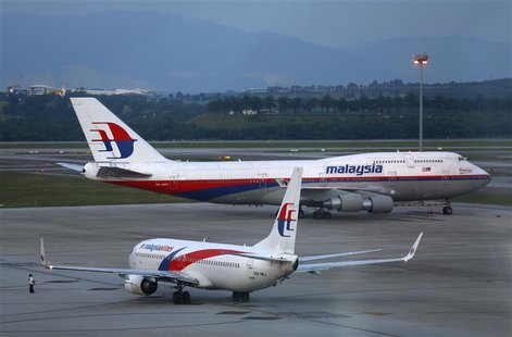 Malaysia Airlines aircrafts taxi on the runway at Kuala Lumpur International Airport in Sepang outside Kuala Lumpur May 13, 2014. REUTERS/Sa Malaysia Airlines aircrafts taxi on the runway at Kuala Lumpur International Airport in Sepang outside Kuala Lumpur May 13, 2014. REUTERS/Sa