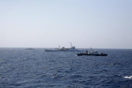 Two Vietnamese Marine Guard ships flank a Chinese coast guard vessel (C) on the South China Sea, about 210 km (130 miles) offshore of Vietna Two Vietnamese Marine Guard ships flank a Chinese coast guard vessel (C) on the South China Sea, about 210 km (130 miles) offshore of Vietna