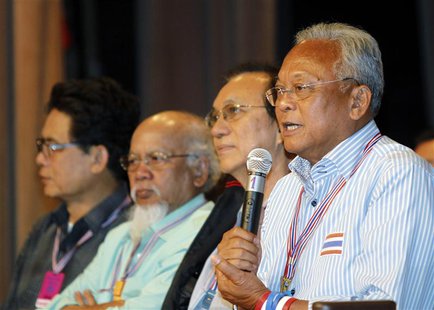 Anti-government protest leader Suthep Thaugsuban (R) speaks during a meeting with his supporters at the Government House in Bangkok May 17, Anti-government protest leader Suthep Thaugsuban (R) speaks during a meeting with his supporters at the Government House in Bangkok May 17,