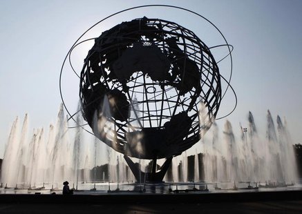 A woman is seen in silhouetted against the sun at the Unisphere fountain at Flushing Meadows-Corona Park in the Queens borough of New York J A woman is seen in silhouetted against the sun at the Unisphere fountain at Flushing Meadows-Corona Park in the Queens borough of New York J