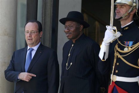 French President Francois Hollande (L) welcomes Nigerian President Goodluck Jonathan as he arrives to attend the African Security Summit at French President Francois Hollande (L) welcomes Nigerian President Goodluck Jonathan as he arrives to attend the African Security Summit at