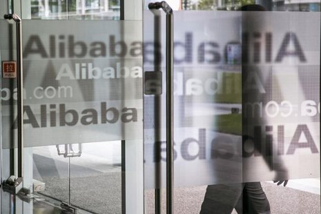 A man walks out of a building at Alibaba's headquarters on the outskirts of Hangzhou, Zhejiang province April 23, 2014. REUTERS/Chance Chan A man walks out of a building at Alibaba's headquarters on the outskirts of Hangzhou, Zhejiang province April 23, 2014. REUTERS/Chance Chan