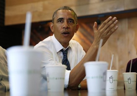 U.S. President Barack Obama talks while having lunch with construction workers at Shake Shack in Washington May 16, 2014. REUTERS/Kevin Lama U.S. President Barack Obama talks while having lunch with construction workers at Shake Shack in Washington May 16, 2014. REUTERS/Kevin Lama
